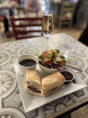 French dip, side salad , and Prosecco