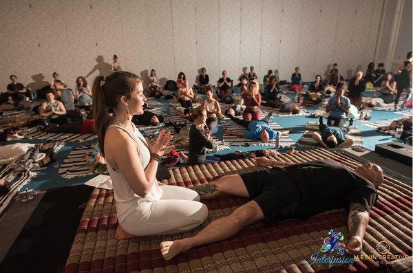 Jess teaching a group of 200 participants at Interfusion Festival in Alexandria VA, January 2020