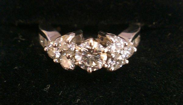 Customized diamond engagement ring in 14K white gold.