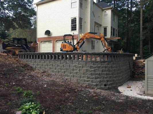 New retaining wall with custom guardrail