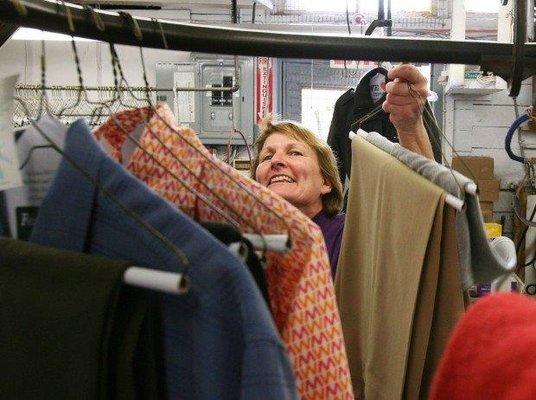 Clothes being inspected by Bonnie Smith, our production manager.