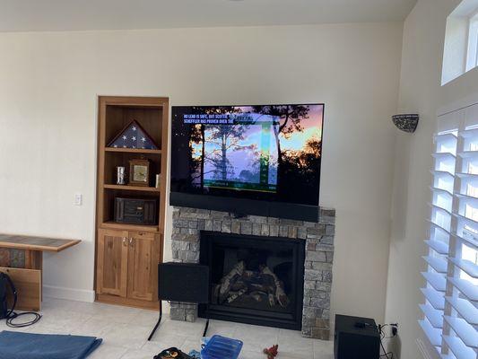 Custom Home Theater 5.2.1 with Mantle Mount over fireplace.