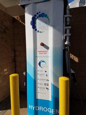 Blue Hydrogen pump at the rear of a 76 gas station