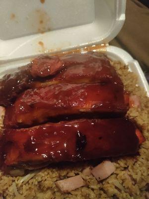 Dinner portion of BBQ ribs over Ham Fried Rice