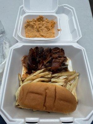 From the Top: side of Buffalo Chicken Dip, Pulled pork, side of fries, potato hotdog roll