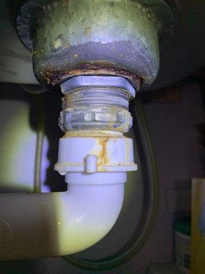 Area wear pipe meets sink. Rotted under sink. Leaking.