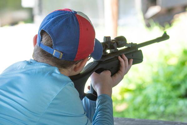 Air Rifle class for older campers teaches safe rifle handling under certified 4-H Shooting Sports instructors.