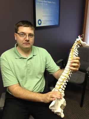 Dr. Shane Kepler with our office mascot, Carl.