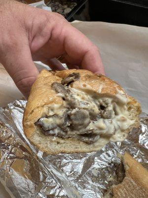 Cheesesteak with extra cheese and fried onions