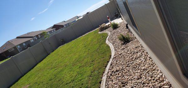 Installed sprinklers, curbing, rock ,sod, trees, bushes