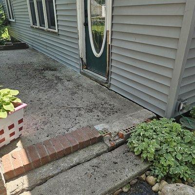 Siding repaired with brick porch removed from home, new drip edge installed