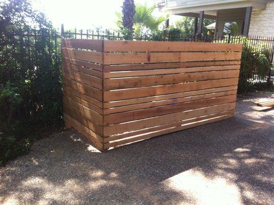 A simple but elegant hiding place for trash carts.