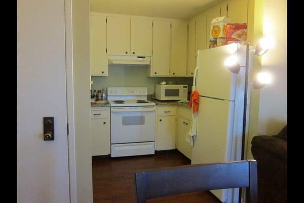 very nice studio kitchen: granite counters and ice-maker included in freezer.