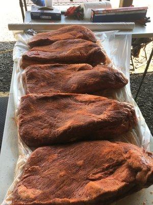 Brisket getting ready for their long journey of smoke and low heat.