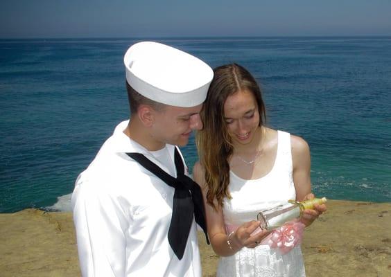 Us looking at the beautiful keepsake they gave us for our special day.