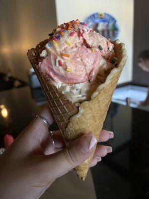 Strawberry Cheesecake and Butter Pecan Ice Cream Scoops in a Vanilla waffle with Sprinkles