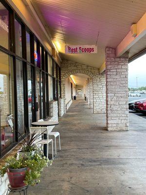 Outside walkway shows the sign for the shop.