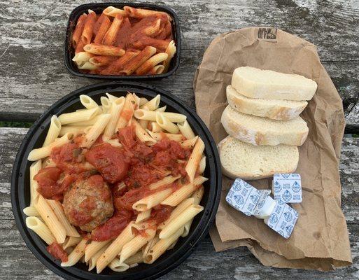 Penne with meatballs, extra pasta, bread.