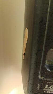 Yeah, that's a bandaid, stuck on the side of a soap dispenser.