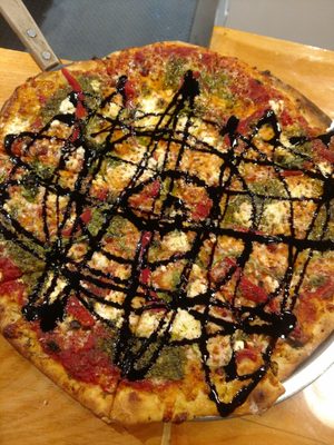 Sweet Jane pizza - pesto, goat cheese, arugula, and balsamic glaze. Yum!