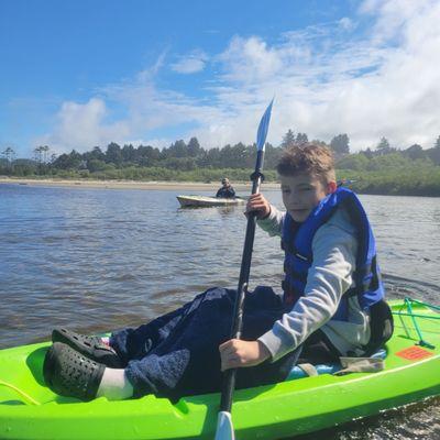 Grandson on his rented kayak. Ona Beach park.