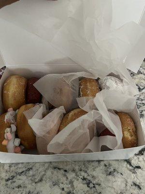 I got a dozen. My favorite had to be the glaze and chocolate sprinkles but they were all delicious