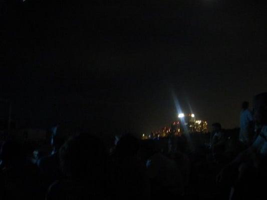 The participants, with light pollution (which disorients baby sea turtles!) behind us.