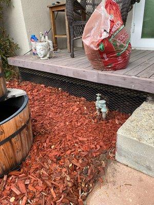 Installing expanded metal to keep animals from crawling underneath customer's deck