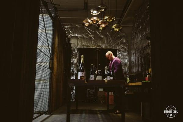 Nick Davis of Medium Plus organizing some champagne bottles