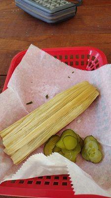 Tamale. They sell hot dogs too which is why there are pickles