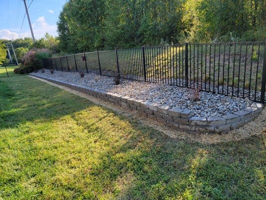 Burm creation with fencing and landscaping.