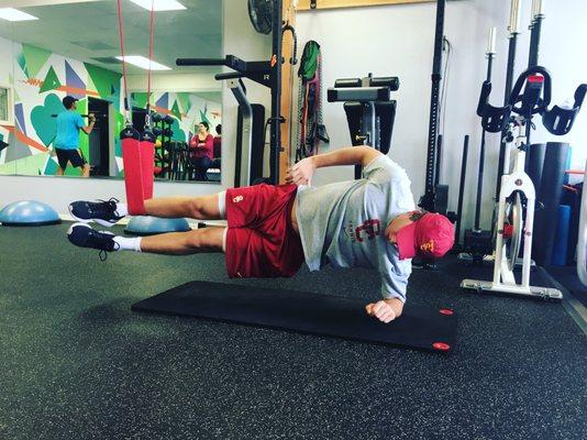 USC Tennis Player working on core stability with Redcord suspension training system.