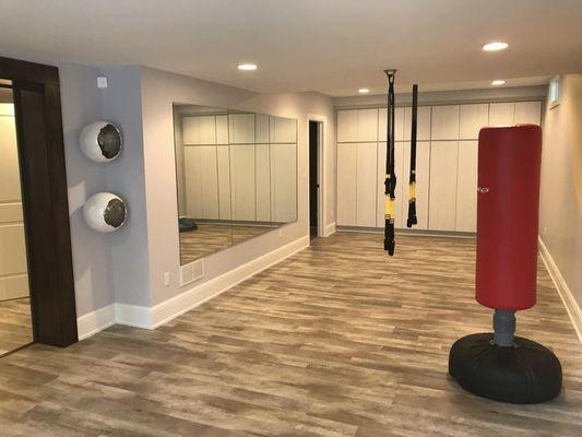 Exercise room with a full wall of mirrors to assure proper form :-)