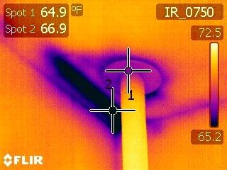 Infrared Image of an air leak around a stove pipe.