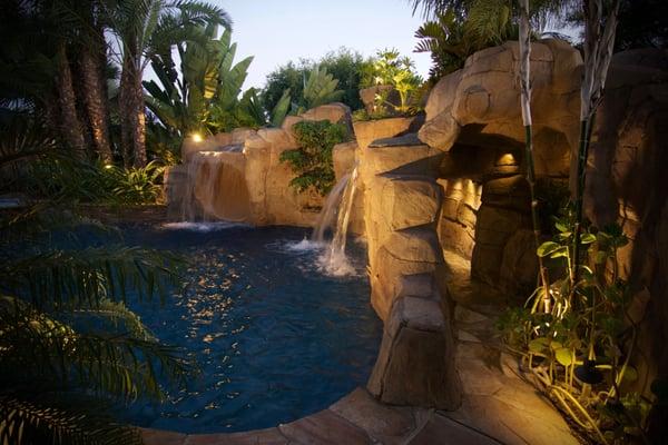 Custom swimming pool with waterfalls and hidden grotto.