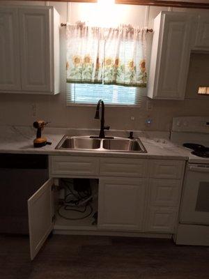 Kitchen remodeling and cabinet installation floating floor s and interior trim and painting