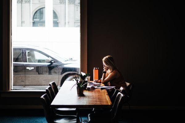 People working in the hourly coworking lounge (Main Hall)