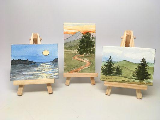 Mini easel paintings are a small, easy to pack form of art.