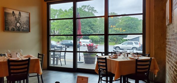 Outdoor seating and huge windows (that appears to slide open)