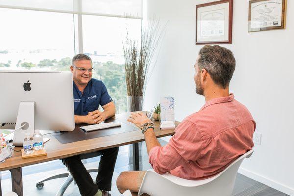 Dr. Luis Dominguez consulting with a patient.