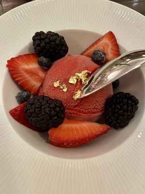 Raspberry sorbet with fresh fruit and gold flakes