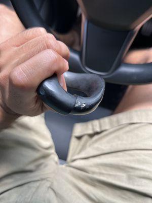 Damaged steering wheel attachment, was bent and scraped up