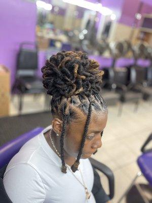 Retwist and style petal locs