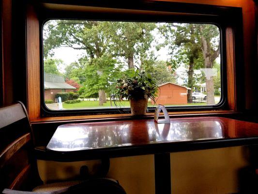 Observation Deck in the Sam Hawkins car of the SAM SHORTLINE EXCURSION TRAIN. That's Plains, Georgia in the background.