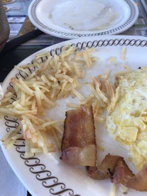 Hash browns were uncooked on bottom of pile and the bacon that was limp that I took home for the dog