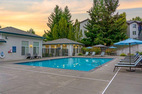 Community Swimming Pool featuring seating areas and lounge chairs.