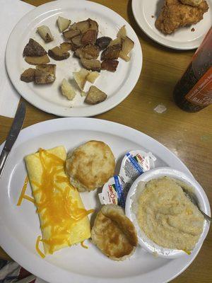 Egg and Cheese Omelet with Biscuits, cheddar grits, fried potatoes