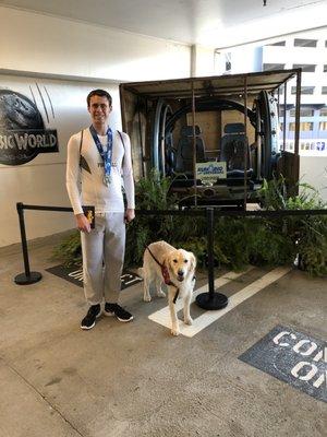 Caleb and his service dog Rowdy at Universal Studios.