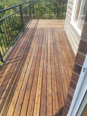 Deck after power washing and sealing.