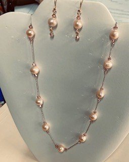 Hand knotted Pearls and Swarovski crystals.